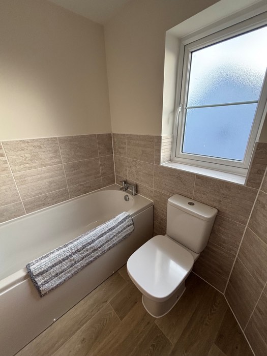 Family bathroom with bath