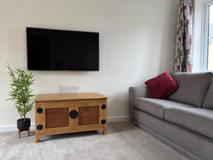 Lounge with wall-mounted Smart TV