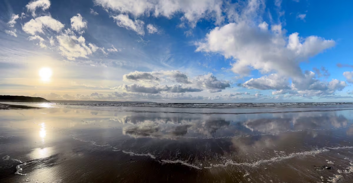 Sunset reflected on the beach near Westward Ho!